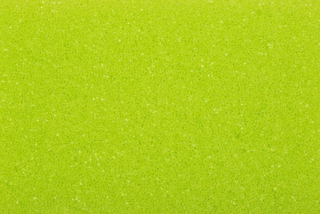 Photo a green foam background with a white speckled pattern.