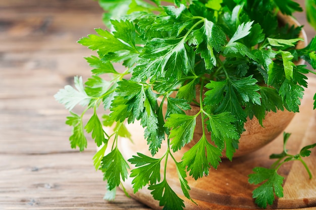 Green fresh parsley on the vintage table