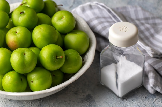 Green fresh plums and salt