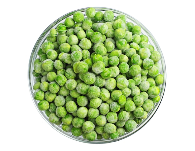 Green frozen peas in a glass bowl isolated on white. Top view