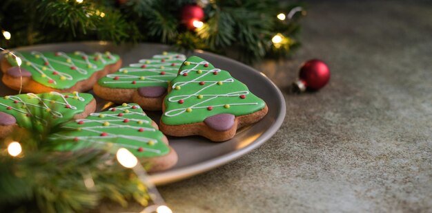 Green gingerbread cookies in the shape of a Christmas tree Christmas banner