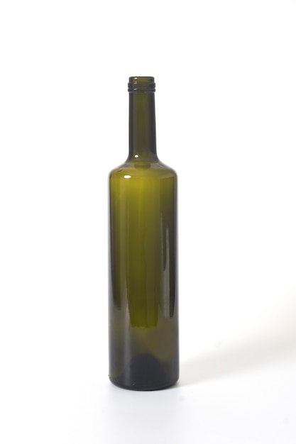 Green glass bottle of alcohol standing on white background