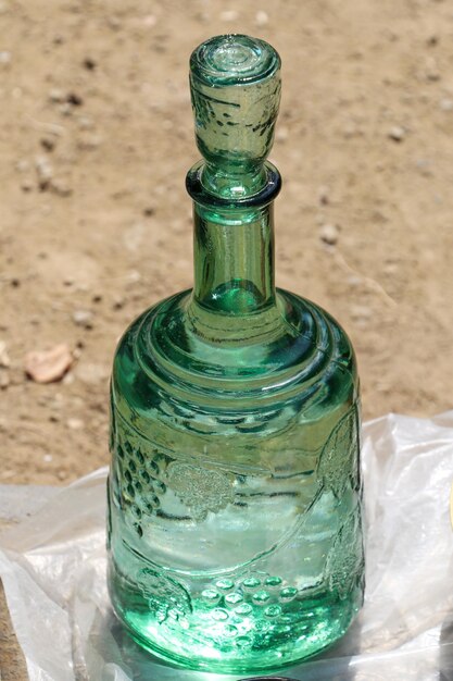 Photo green glass jug in oriental style