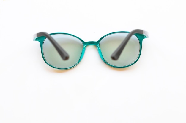 green glasses on white background