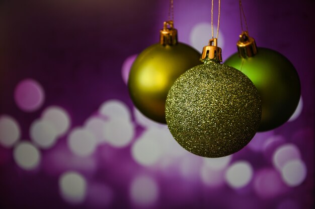 Green and gold christmas ornament balls holiday background abstract christmas holidays background wi...