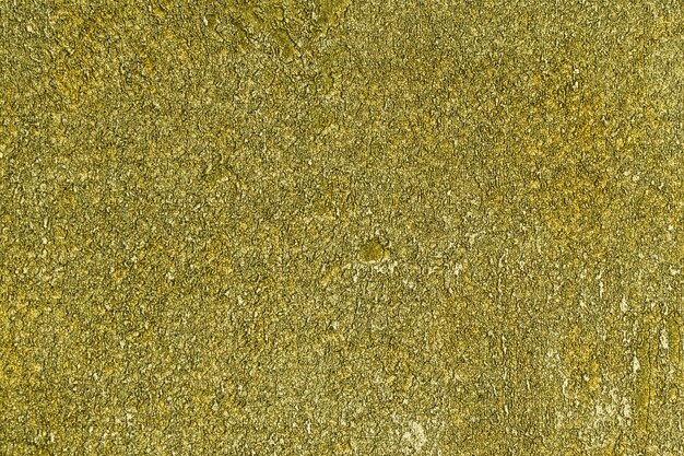 グリーンゴールドのキラキラ背景キラキラ光るラッピング紙の質感