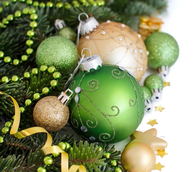 Green and golden Christmas ornaments border isolated