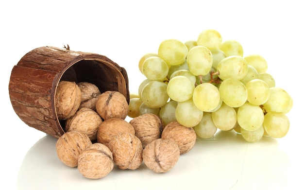 Green grape with nuts isolated on white