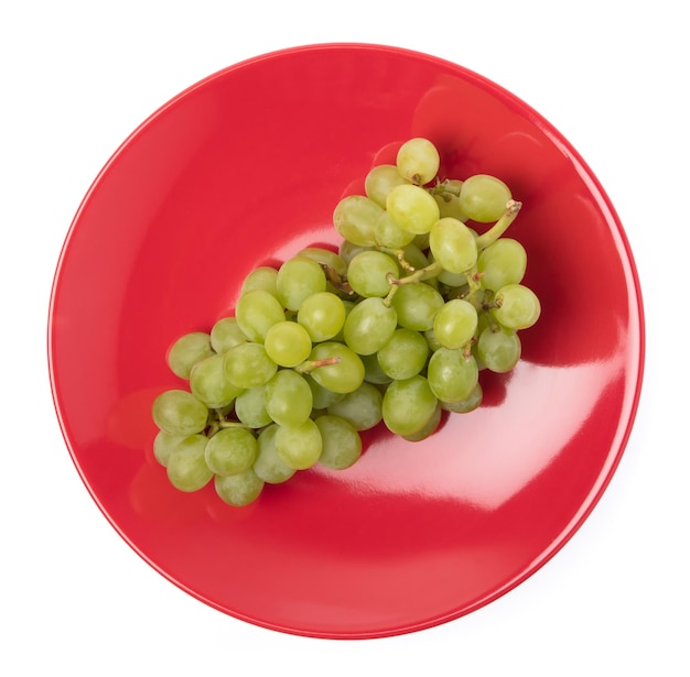 Green grapes on dish isolated on white background