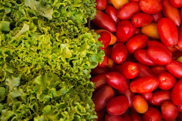 green grapes and red tomatoes at an outdoor market