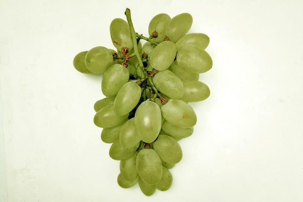 Green grapes on white background