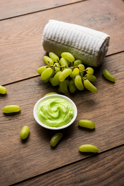 Green grapes, yogurt and honey mix face mask or cream for skin dark spot removal treatment, created using Angoor extract, curd and honey. selective focus