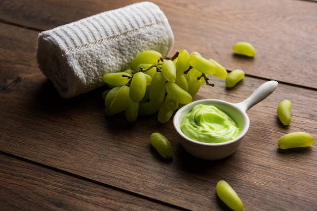 Green grapes, yogurt and honey mix face mask or cream for skin dark spot removal treatment, created using Angoor extract, curd and honey. selective focus