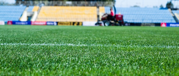 Green grass on outdoor stadium selective focus sport and games healthy lifestyle