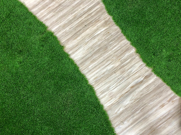 Green grass with the wooden floor 