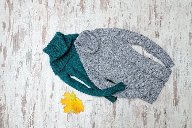 Green and gray  warm sweater with neck. Fashionable concept.