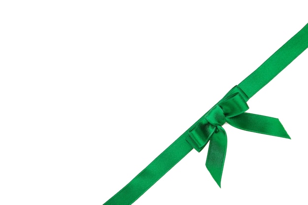 Green handmade ribbon with bow isolated on white surface