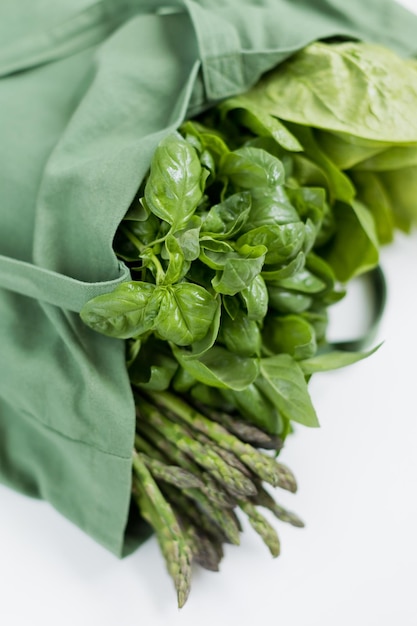 Photo green herbs in bag white background