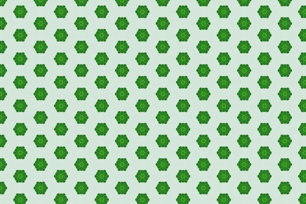 Green hexagons with a pattern of leaves on a light green background.