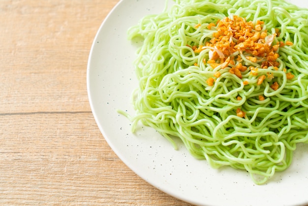 Green jade noodle with garlic on plate