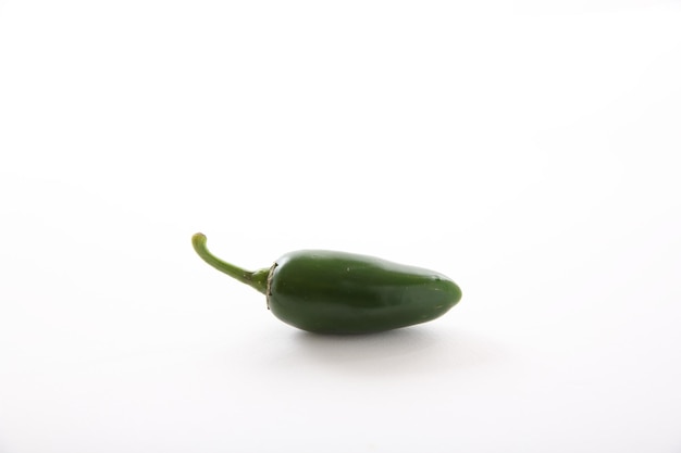 Green jalapeno chili pepper isolated in white background