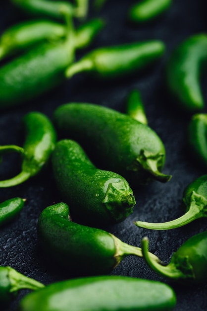 Green Jalapeno Peppers on Concrete Background