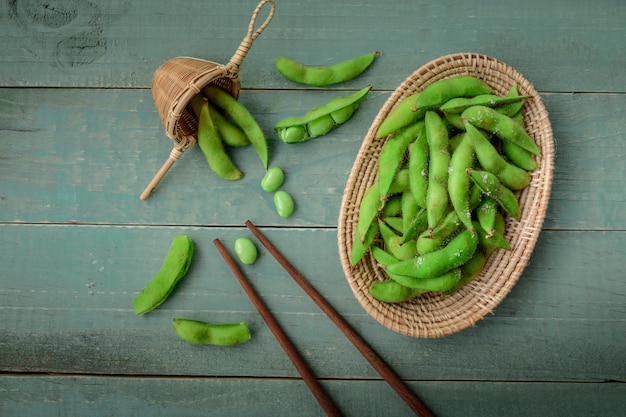 Green Japanese Soybean in wooden bowl on table wood