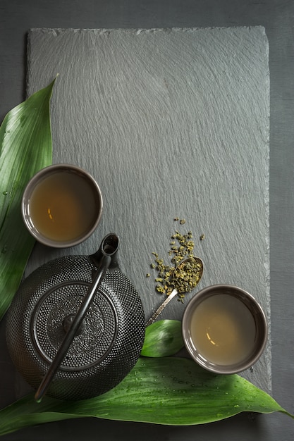 Green japanese tea on black slate