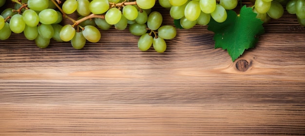 Green juicy grapes on wooden background