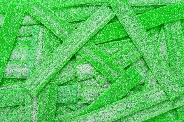 Green juicy gummy candies background. Top view. Jelly  sweets.