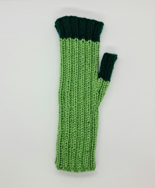 A green knitted glove