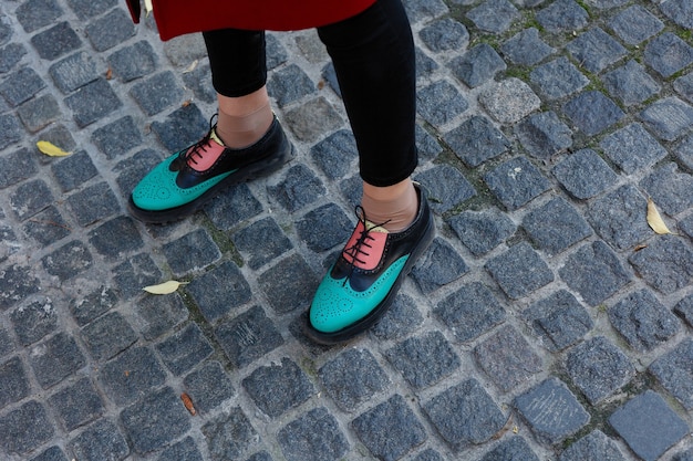 Green lacquered oxford shoes . Top view. Close up. hipster woman wear fashion shoes tassel loafer