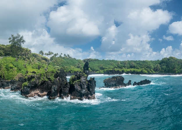 Green lava rocks at Waianapanapa on the road to Hana in Maui