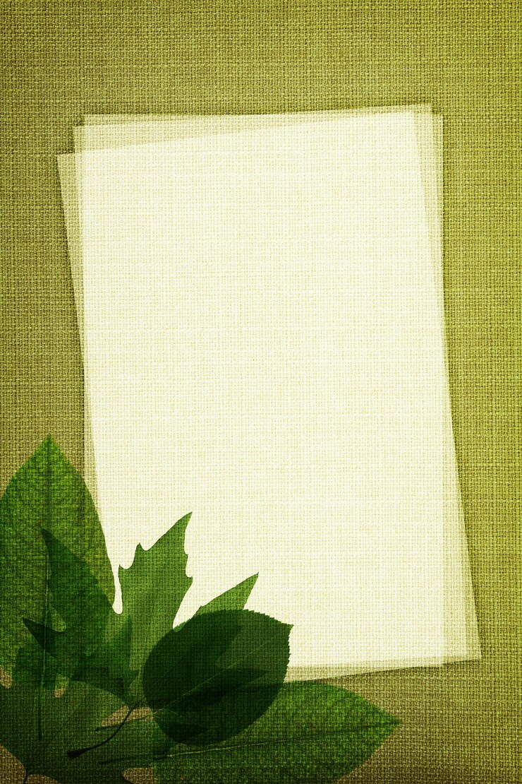 Green leaves on fabric texture with copy space