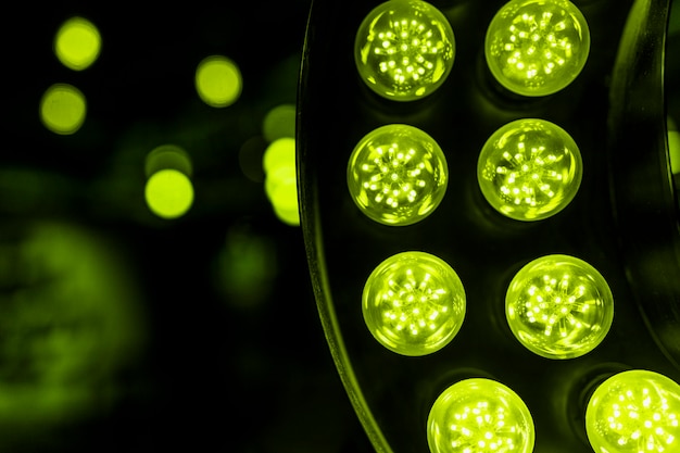 Green led light against bokeh backdrop