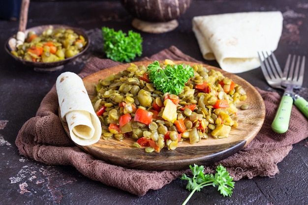 Green lentil stew (curry) with apple, bell pepper and onion. 