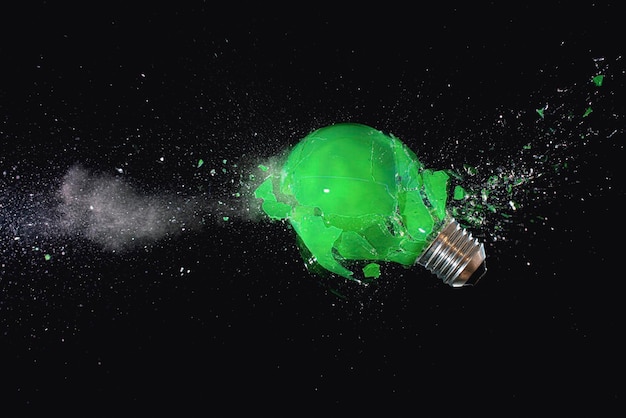 Green light bulb shattering. high speed photography