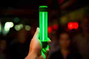 Photo green light euphoria shot of green light stick indicating the go signal