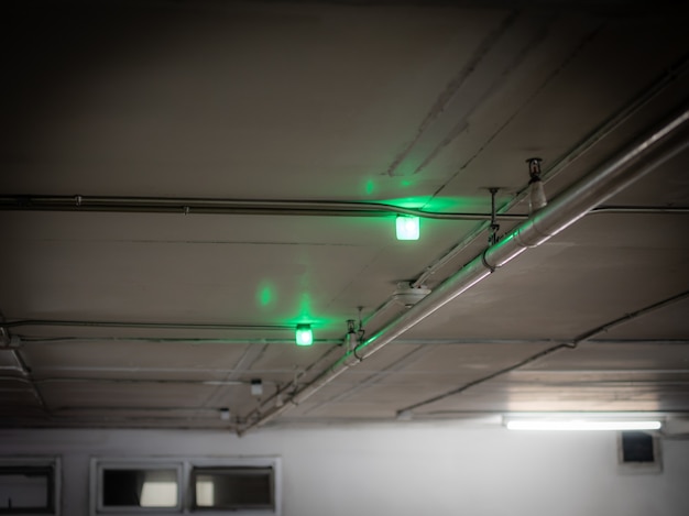 The green light for the parking spot is installed in the indoor parking lot.
