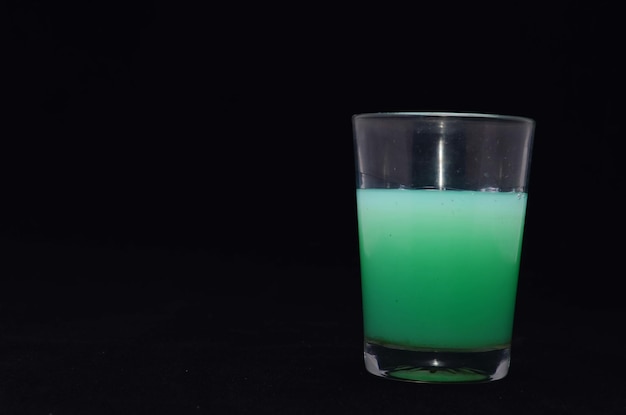 Green Liquid Glass on a Black Background