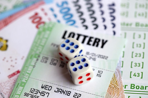 Green lottery tickets and indonesian money bills on blank with numbers for playing lottery