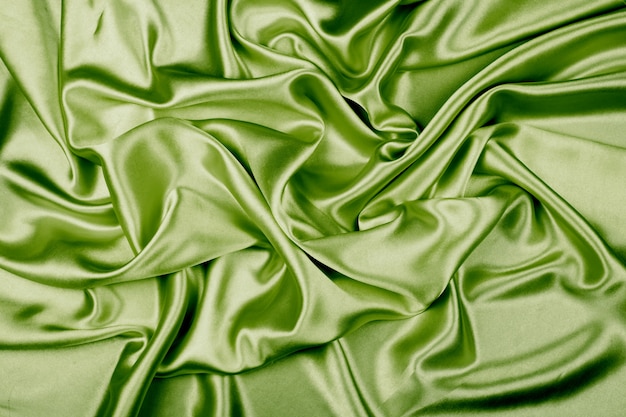 Зеленая роскошная атласная текстура ткани для фона