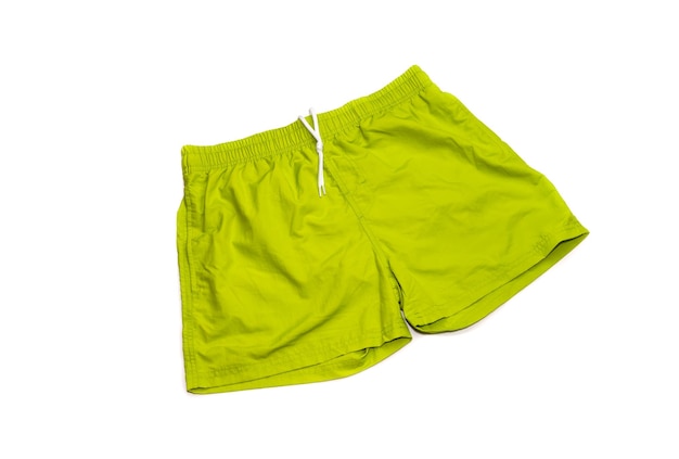 Green male swimming trunks on a white background