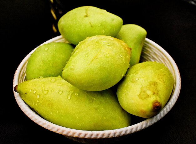 Green mangoes in a Basket