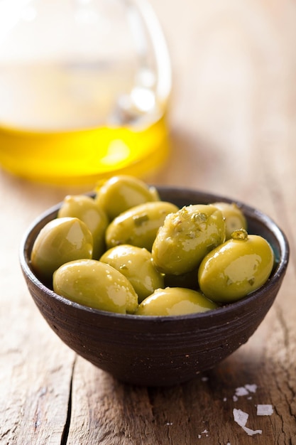 Green marinated olives in bowl