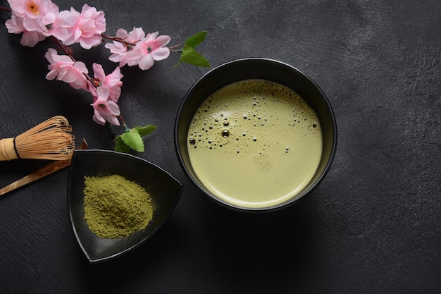 Green matcha tea drink and tea accessories on white background. Japanese tea ceremony concept. Detox tea. Antioxidant drink