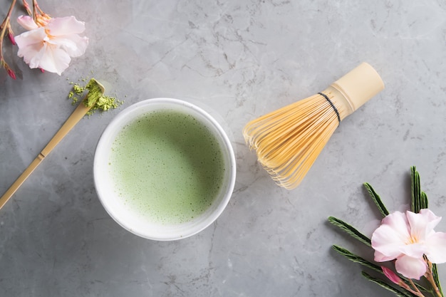 Green matcha tea drink and tea accessories