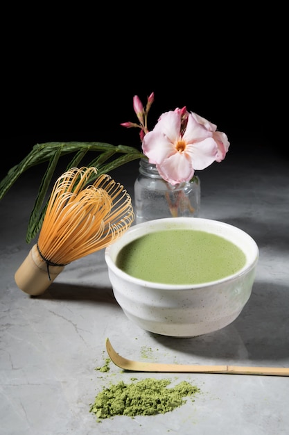 Green matcha tea drink and tea accessories