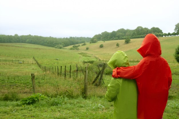 Green meadow with waterproof colorful coat