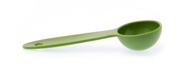 green measuring spoons isolated on white background